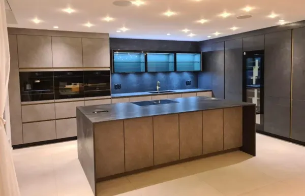 Refurbished kitchen with a bronze-toned island