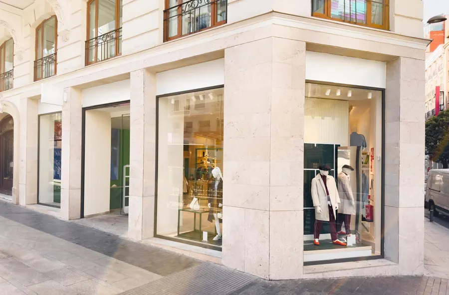 Retail units with limestone façade and large glazed shopfronts after a commercial fit-out